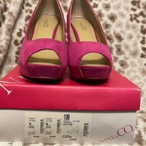 Pink suede platform peep toe pumps